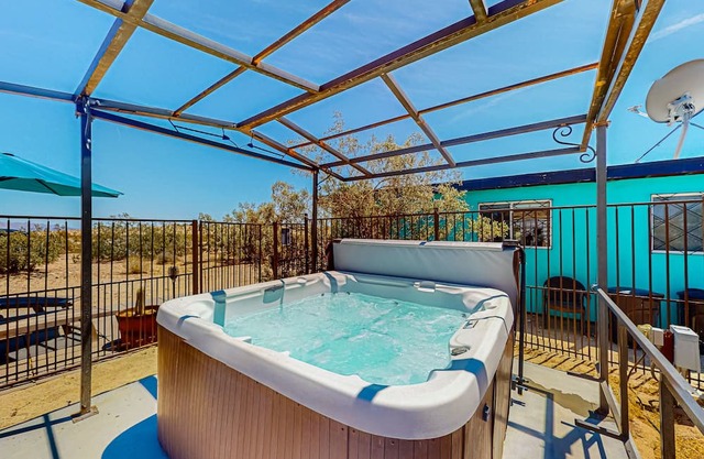 Dog-friendly desert retreat with a private hot tub, furnished patio, & AC