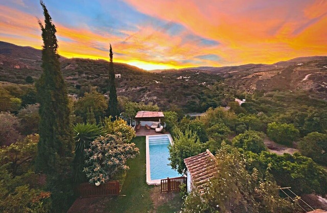 Sunset mountain-view villa with garden & pool