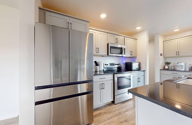 Newly built home with large fenced yard, 2 living rooms & great kitchen