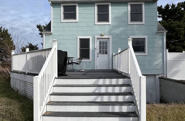 Beachfront Cottage with detached screened porch with stunning beach views.