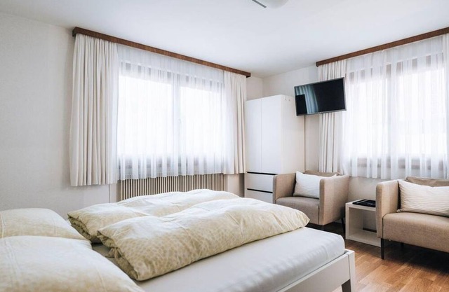 Double room white - Gästehaus Apartments Lässer