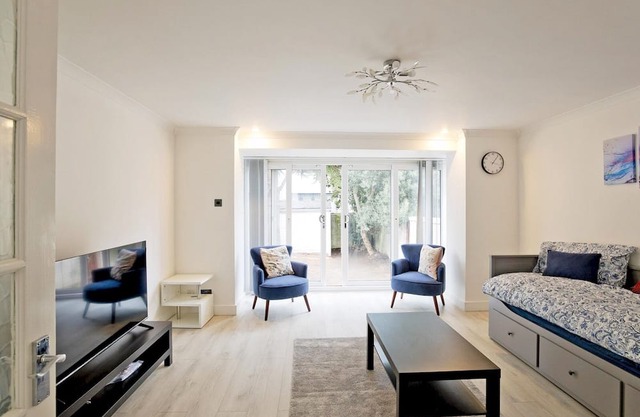 Pass the Keys | Modern Riverside Retreat with Parking