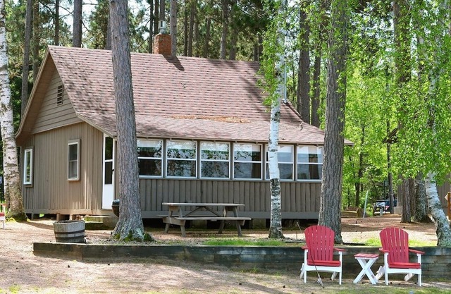 sunset views in Lovely lakefront cabin with AC in charming Saint Germain