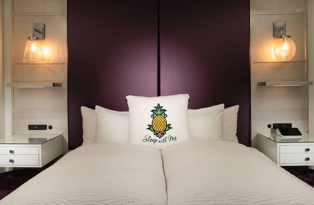 Stylish Queen Room with Vibrant Art and Cozy Comfort, Perfect for Midtown Escape