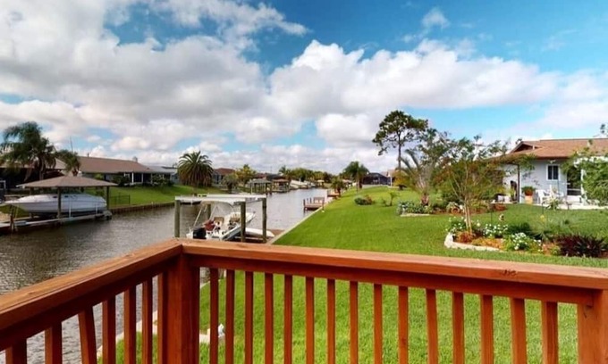 Palm Harbor Haus | Release and Relax swimming pool or fishing right out your back door