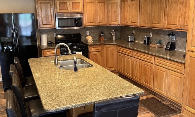 Board Camp Haus | Ride to the ATV trails from this Spacious 4-bedroom house with RV hookup!