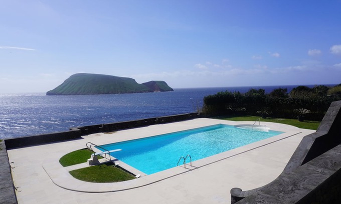 Porto Judeu Haus | Enormous pool and 180 degree ocean view home for 12