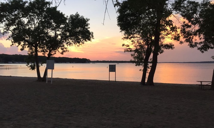 West Okoboji Haus | Hoist available for boats up to 25 ft. Charming 2BR house in lovely W. Okoboji