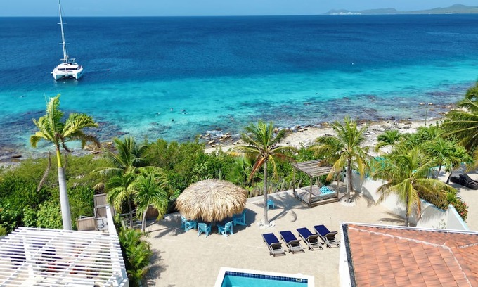 Sabadeco Haus | Crown Ridge 12 – Oceanfront home with private pool & infant of a dive site